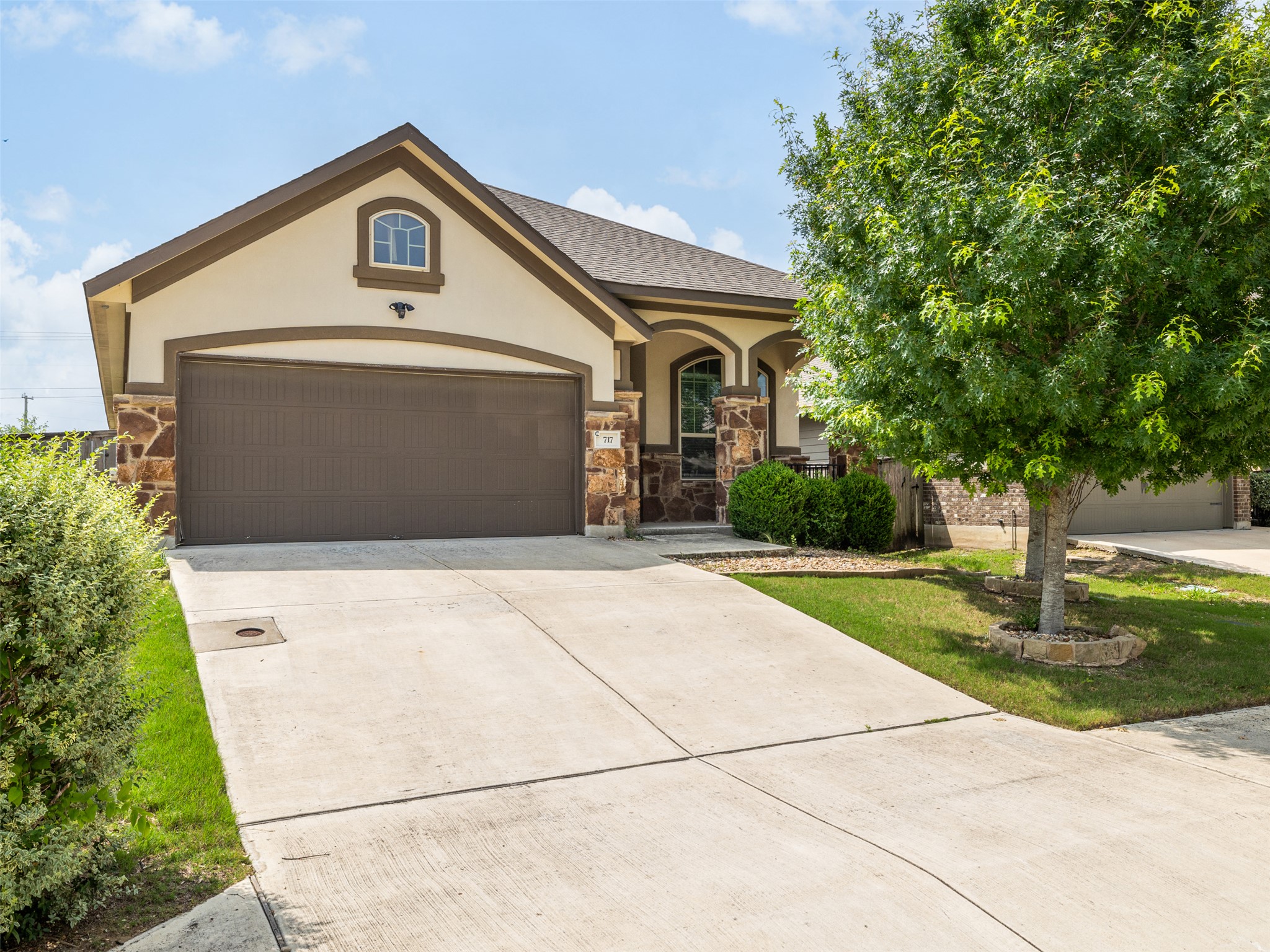 717 Blue Agave Lane Georgetown, TX 78626 - Photo 2 of 28 a front view of a house with a yard