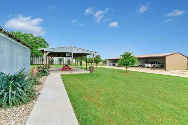 a view of a backyard with garden