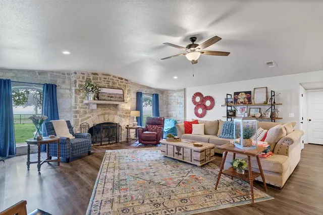 a living room with furniture and a fireplace