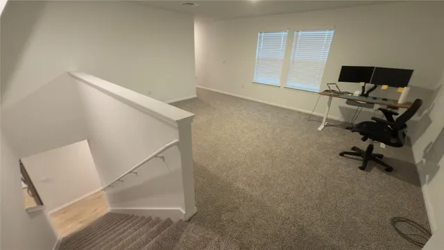 a view of work space with windows