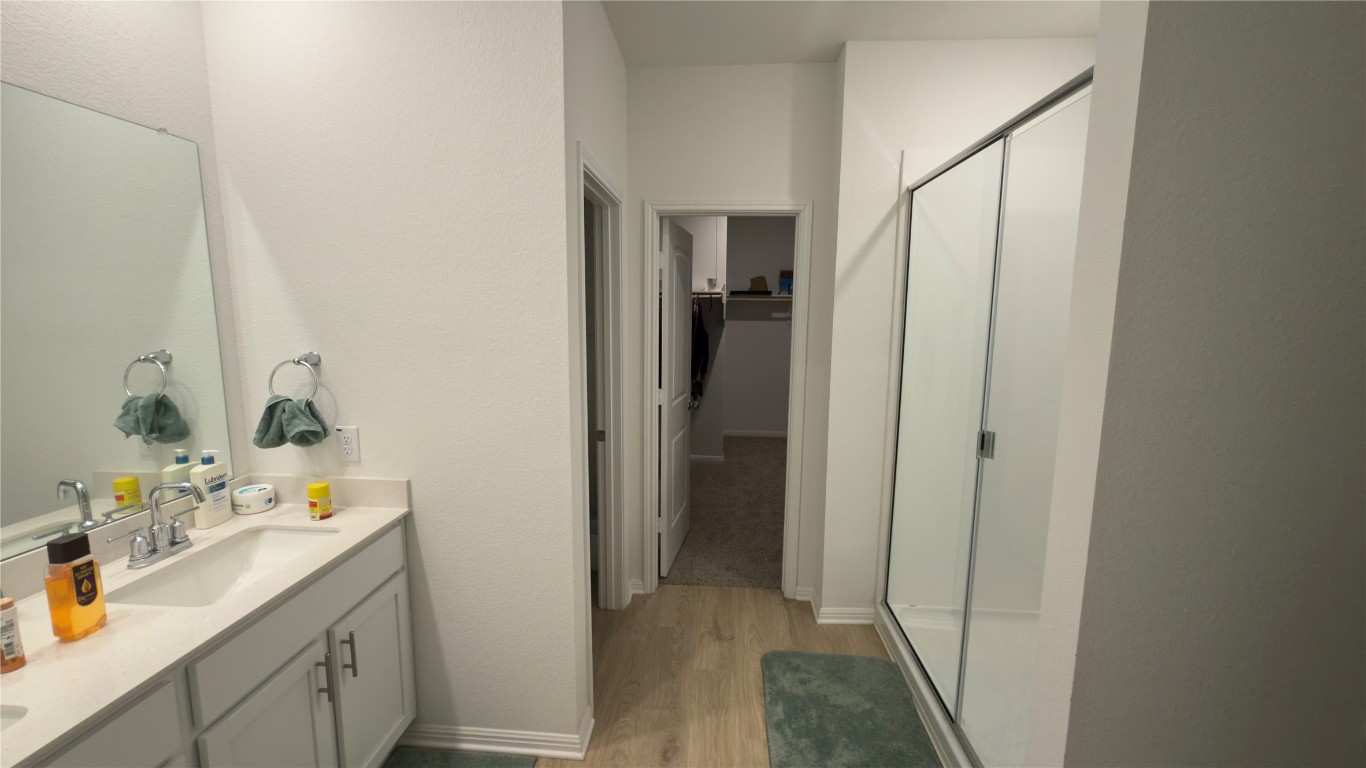 2512 Hackamore Drive Leander, TX 78641 - Photo 26 of 35 a bathroom with a sink and mirror