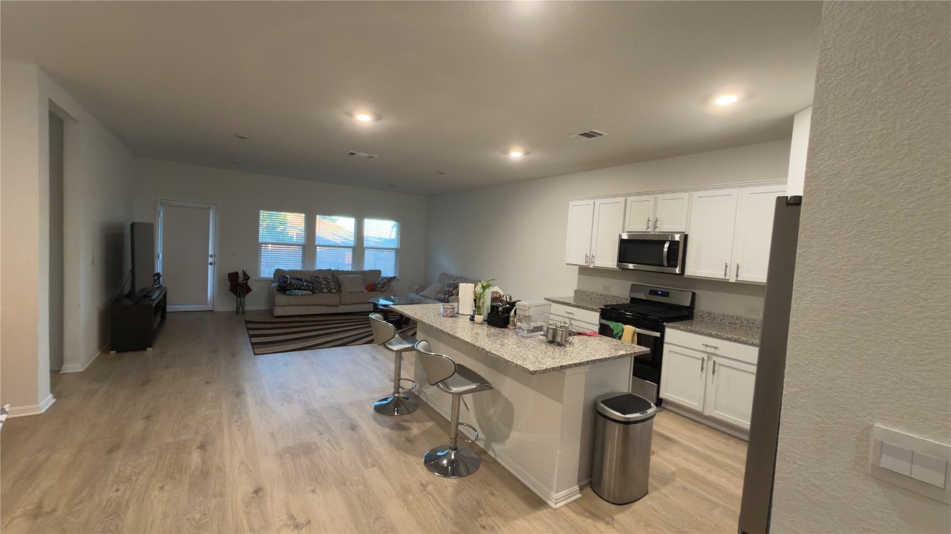 2512 Hackamore Drive Leander, TX 78641 - Photo 35 of 35 a kitchen with a sink appliances and cabinets