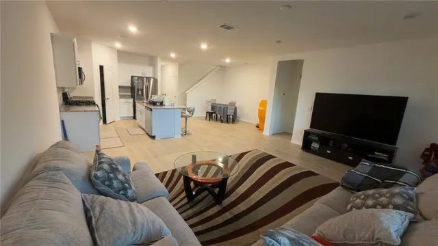 a kitchen with a sink appliances and cabinets