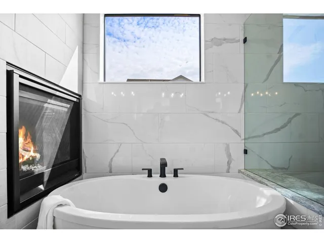 a bathroom with tub sink