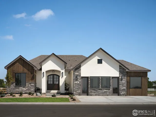 a front view of a house with garage