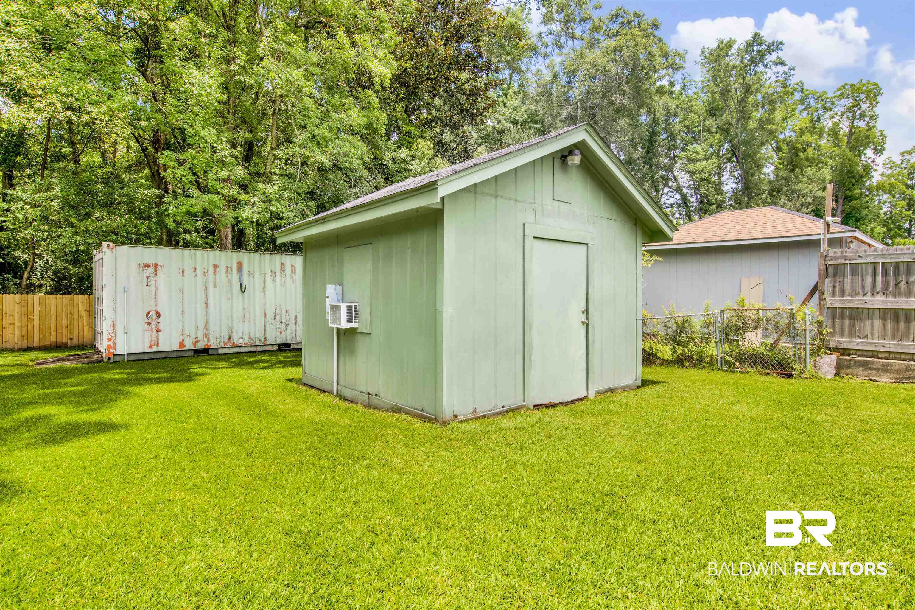 1476 Boudousquie Street Mobile, AL 36605 - Photo 29 of 34 View of shed featuring a fenced backyard