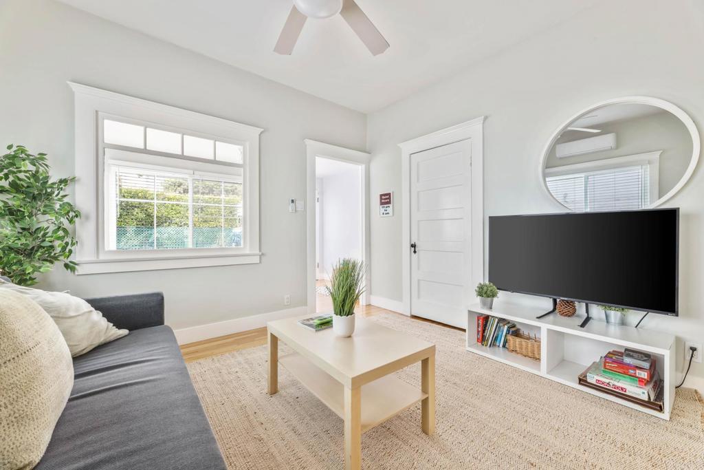2432 3rd Street Santa Monica, CA 90405 - Photo 11 of 62 a living room with furniture and a flat screen tv