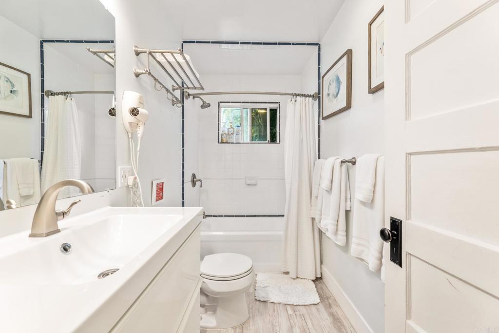 2432 3rd Street Santa Monica, CA 90405 - Photo 21 of 62 a bathroom with a sink a toilet and a large mirror