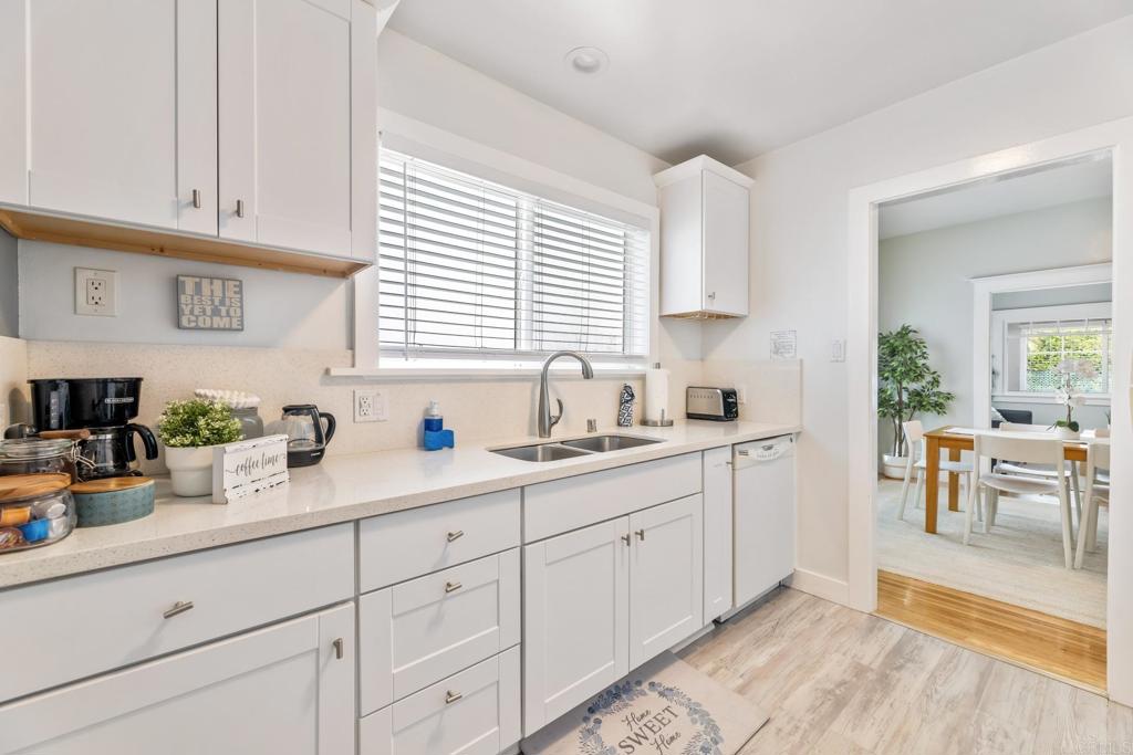 2432 3rd Street Santa Monica, CA 90405 - Photo 30 of 62 a kitchen with white cabinets and sink