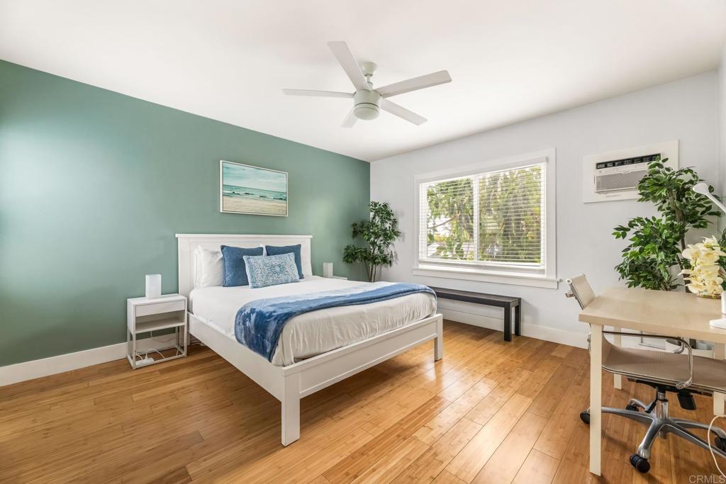 2432 3rd Street Santa Monica, CA 90405 - Photo 36 of 62 a bedroom with a bed wooden floor and a window