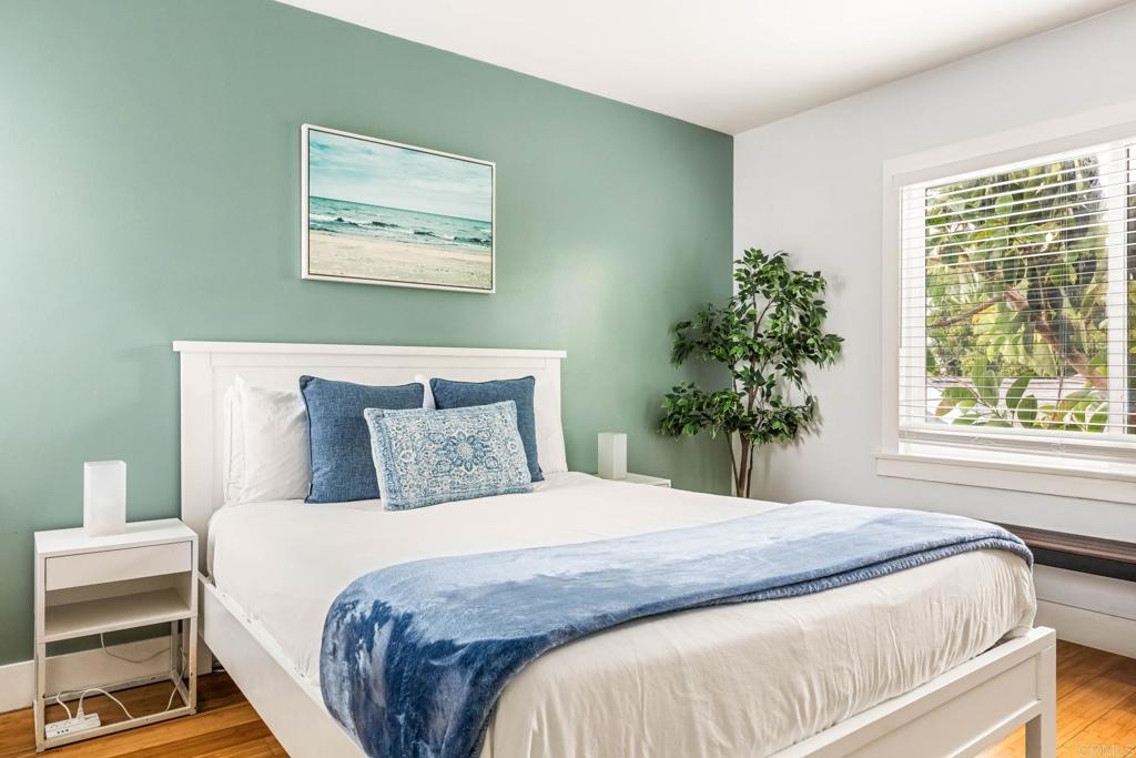 2432 3rd Street Santa Monica, CA 90405 - Photo 48 of 62 a bedroom with a large bed and a potted plant