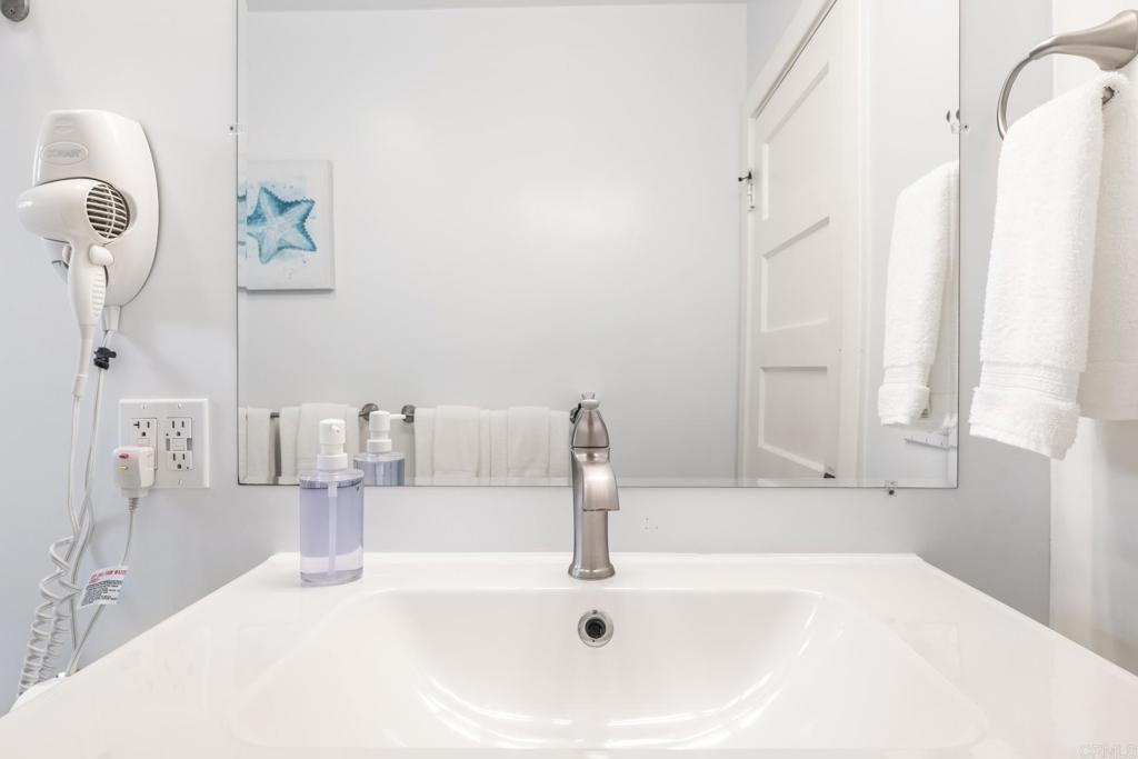 2432 3rd Street Santa Monica, CA 90405 - Photo 57 of 62 a bathroom with a sink and a mirror