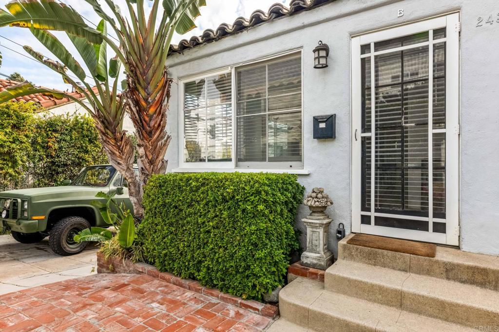 2432 3rd Street Santa Monica, CA 90405 - Photo 62 of 62 a front view of a house with a yard and potted plants
