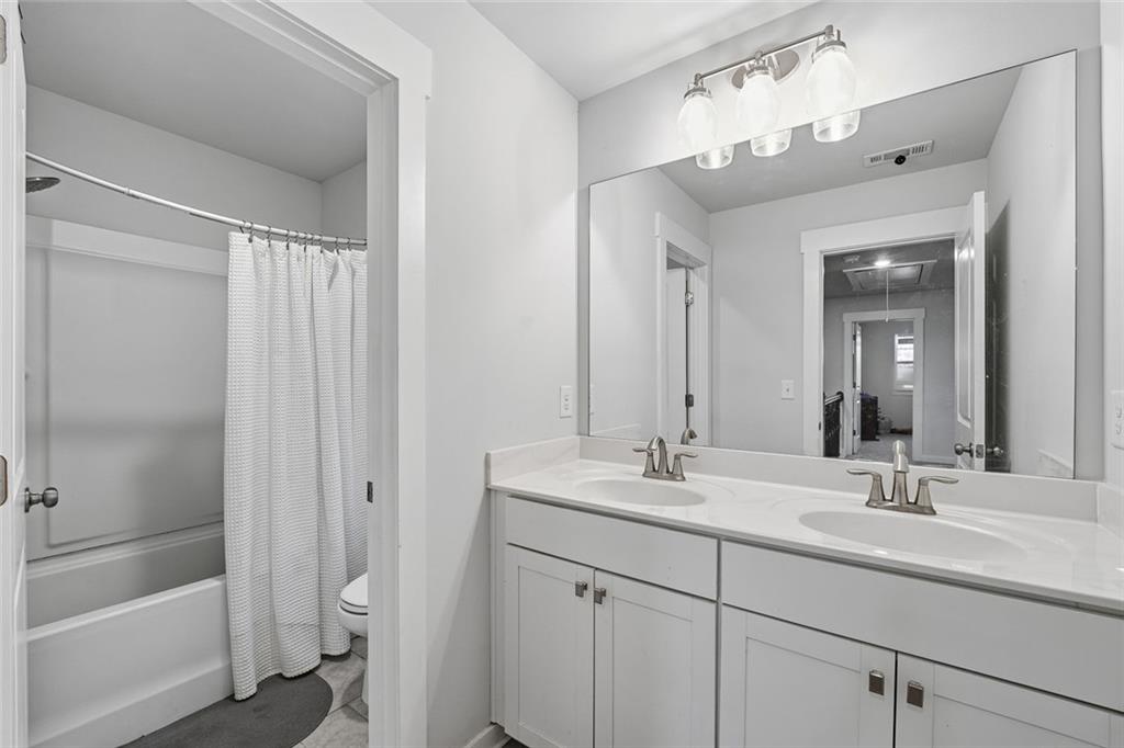 4806 Anvil Court Jefferson, GA 30549 - Photo 20 of 31 a bathroom with a sink a toilet and shower