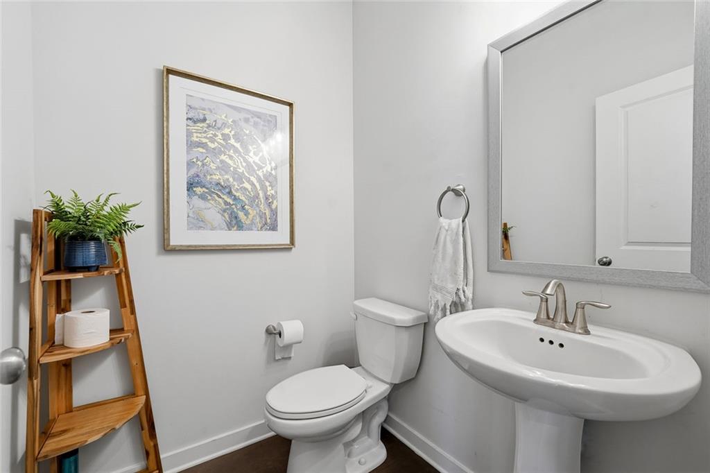 4806 Anvil Court Jefferson, GA 30549 - Photo 21 of 31 a bathroom with a sink toilet and a mirror