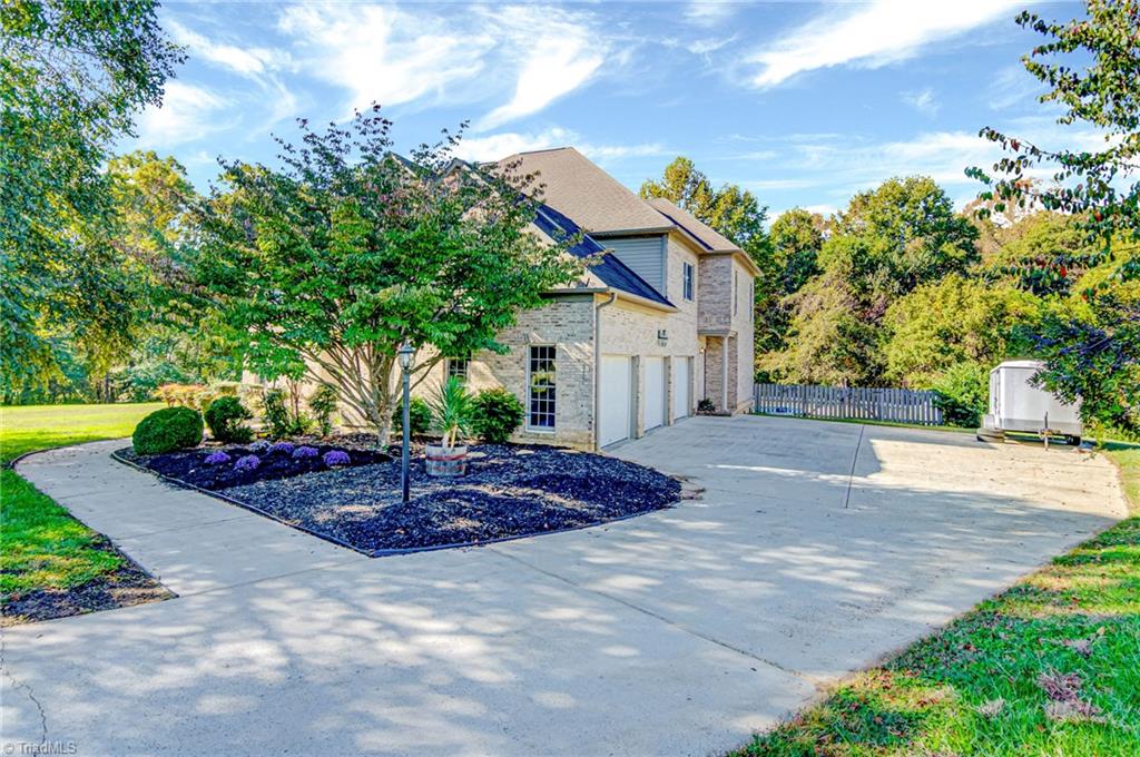 5401 Leytonstone Court Oak Ridge, NC 27310 - Photo 2 of 41 Plenty of parking with 3 car garage.