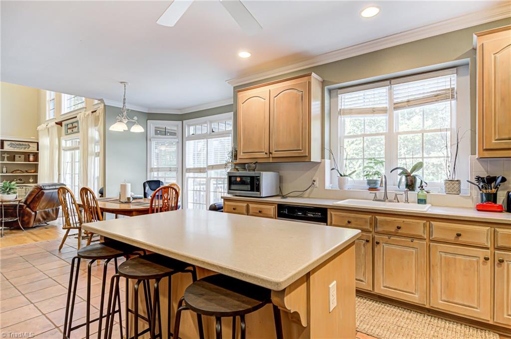 5401 Leytonstone Court Oak Ridge, NC 27310 - Photo 15 of 41 Center island provides additional seating and/or workspace.