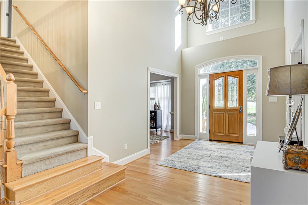 5401 Leytonstone Court Oak Ridge, NC 27310 - Photo 3 of 41 Beautiful 2 story entryway with New Chandelier! Front door has been resurfaced, refinished and new hardware.