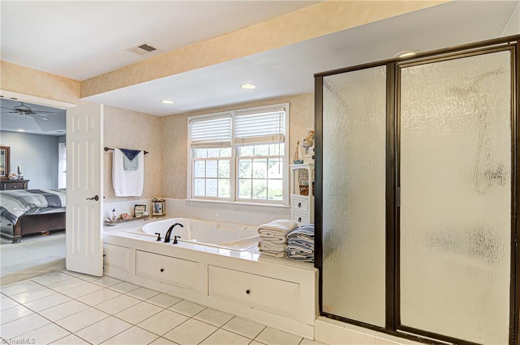 5401 Leytonstone Court Oak Ridge, NC 27310 - Photo 23 of 41 Jetted tub and separate shower.