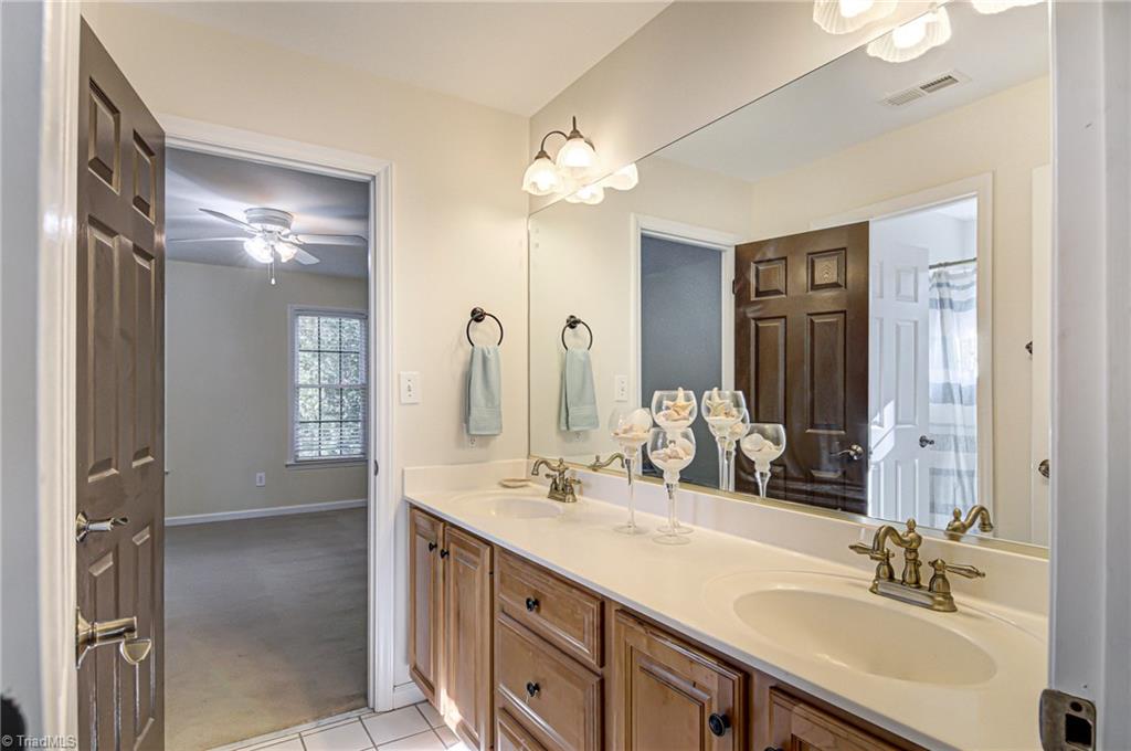 5401 Leytonstone Court Oak Ridge, NC 27310 - Photo 29 of 41 Jack N Jill Bath double sinks and new fixtures and hardware.