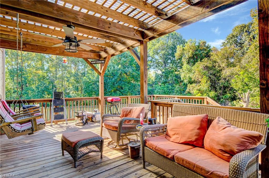 5401 Leytonstone Court Oak Ridge, NC 27310 - Photo 33 of 41 Spacious back deck with covered area and swing.
