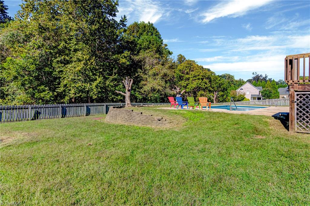 5401 Leytonstone Court Oak Ridge, NC 27310 - Photo 37 of 41 Nice fenced yard perfect for the four legged family members and family yard games.