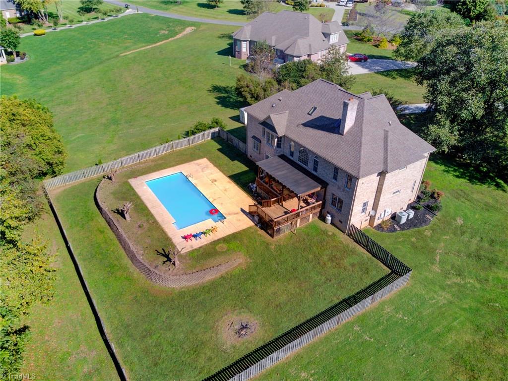 5401 Leytonstone Court Oak Ridge, NC 27310 - Photo 39 of 41 Aerial view of home and fenced yard.