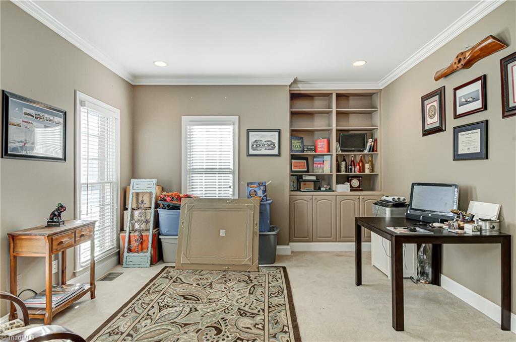 5401 Leytonstone Court Oak Ridge, NC 27310 - Photo 4 of 41 Office is bright and has built in shelving & cabinetry.