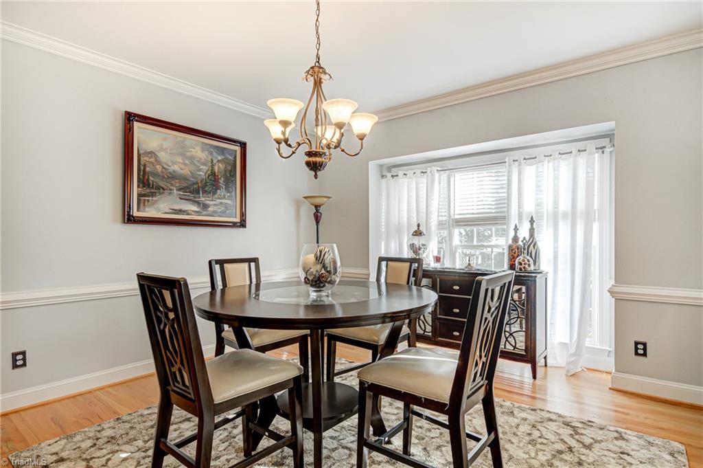 5401 Leytonstone Court Oak Ridge, NC 27310 - Photo 6 of 41 Dining Room with large inset window for natural lighting.