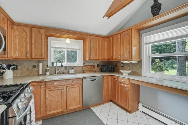 a kitchen with sink cabinets and window