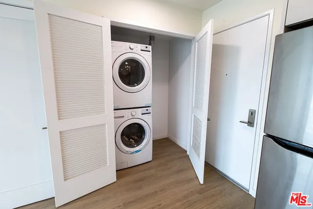 a view of a hallway with washer and dryer
