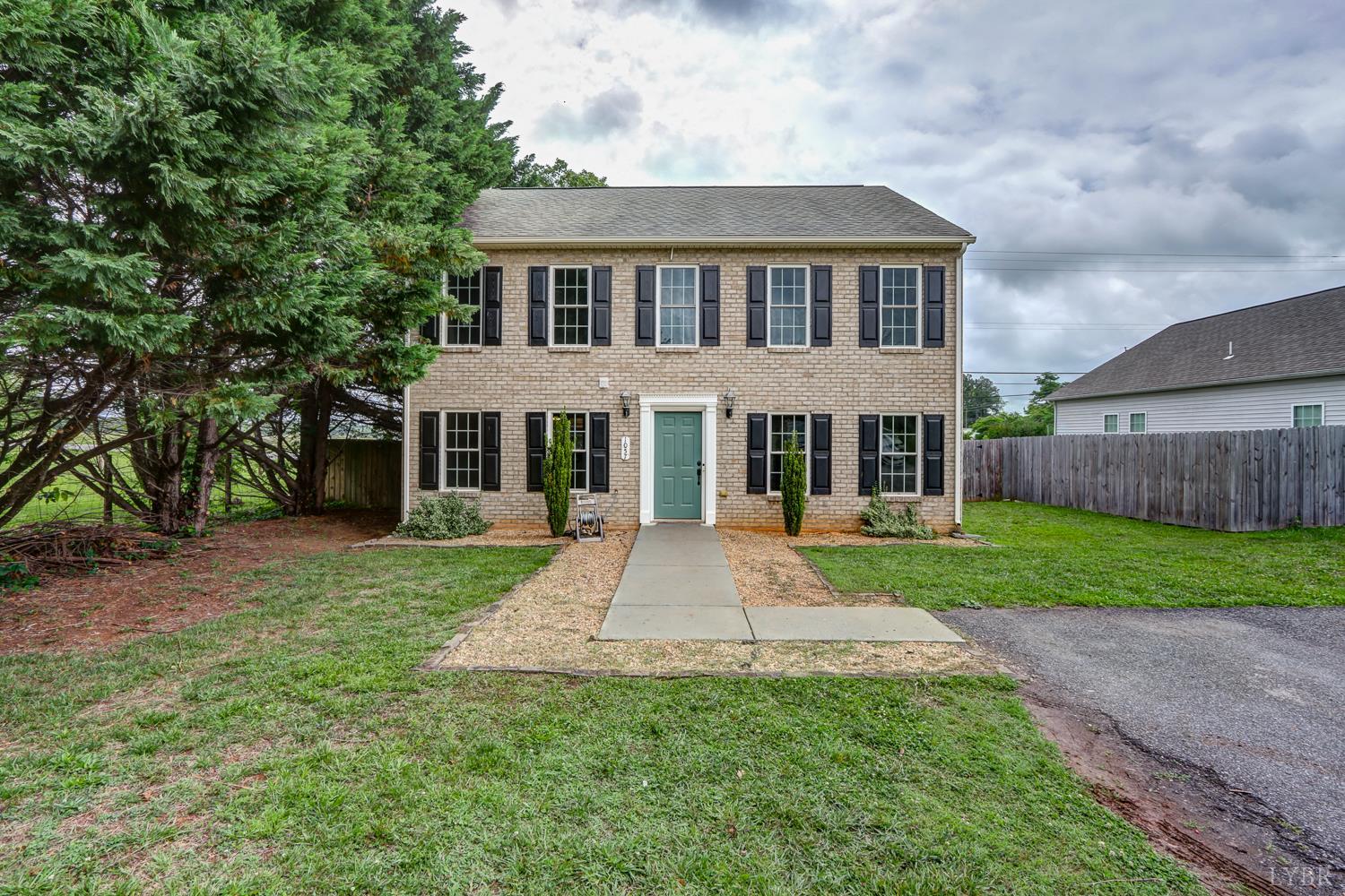 1057 Old Trail Road Forest, VA 24551 - Photo 2 of 49 a front view of a house with a yard