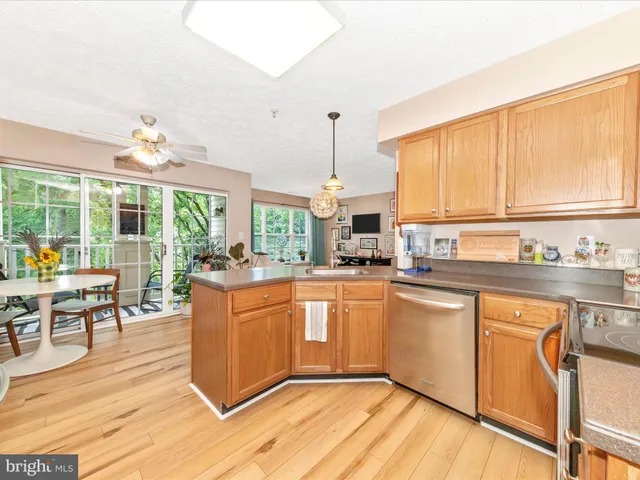 a kitchen with stainless steel appliances a refrigerator and a sink