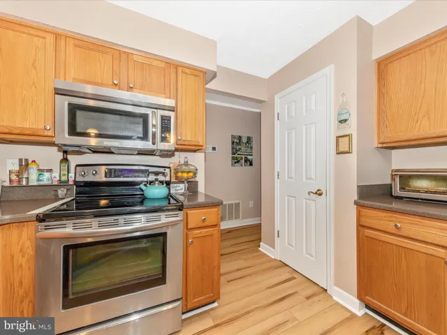 a workspace with furniture and a wooden floor