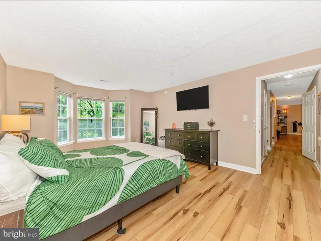 a view of a balcony with wooden floor and outdoor space
