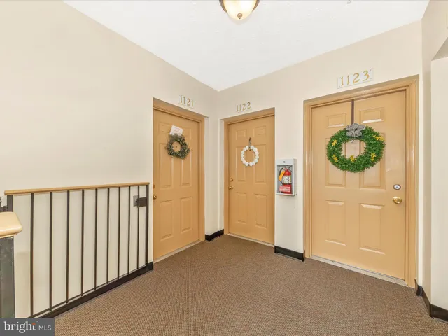 a view of a house with wooden fence