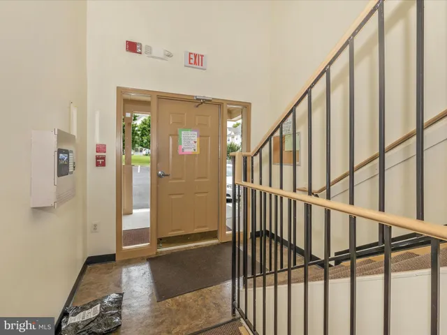 a view of a brick house with large windows