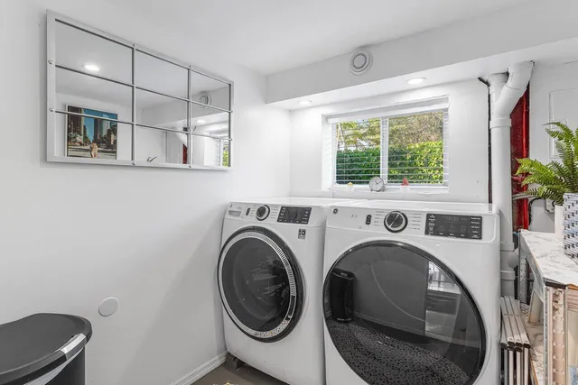 a view of a hallway with washer and dryer