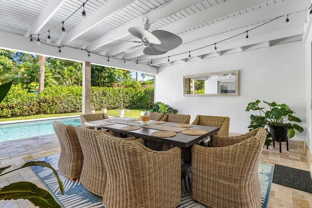 a dining room with large window