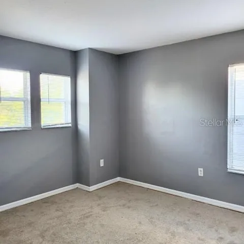 a bathroom with a sink toilet vanity and tub