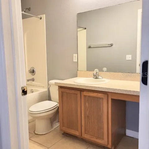 a view of an empty room with a fireplace