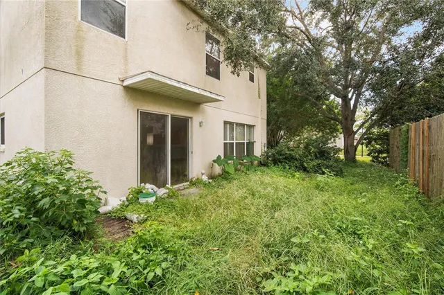 a view of a house with a yard and plants