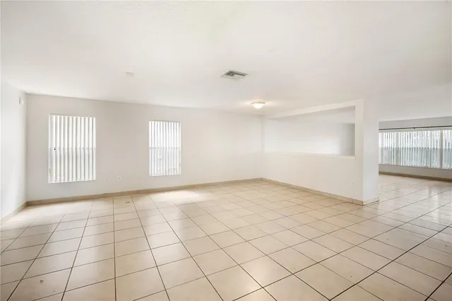 a view of an empty room and window