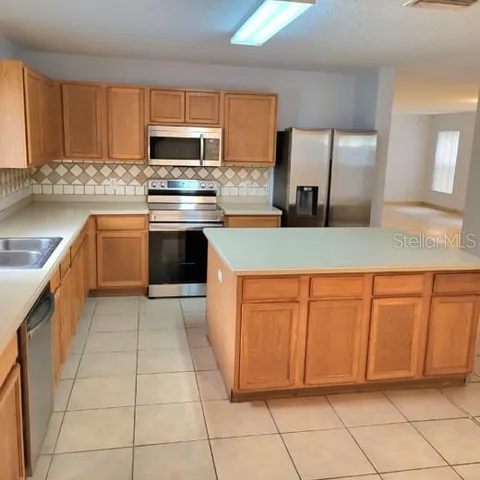 a large kitchen with a cabinets and counter space