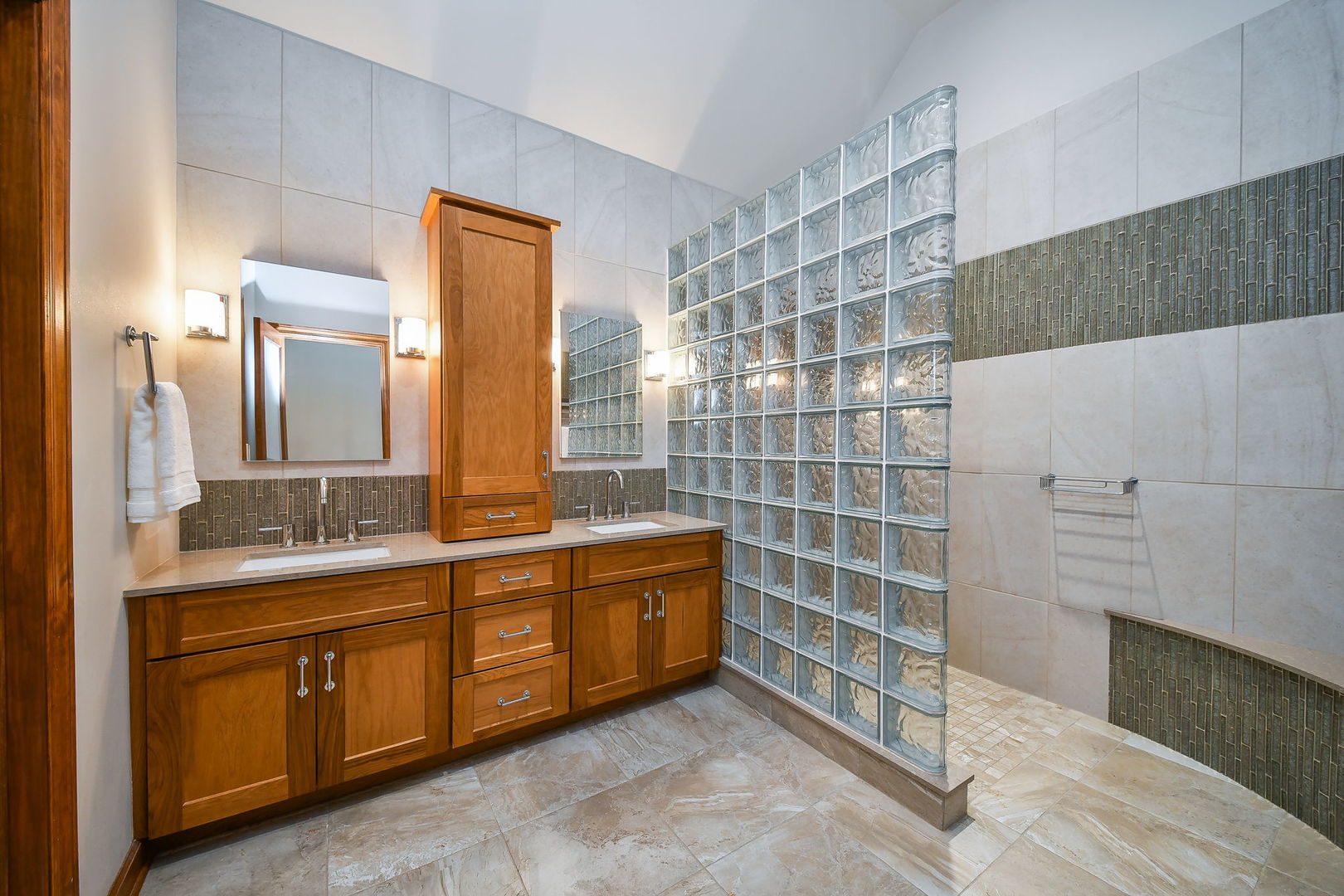 2009 Mackenzie Place, Unit 2009 Wheaton, IL 60187 - Photo 29 of 53 a bathroom with a double vanity sink a toilet and a shower