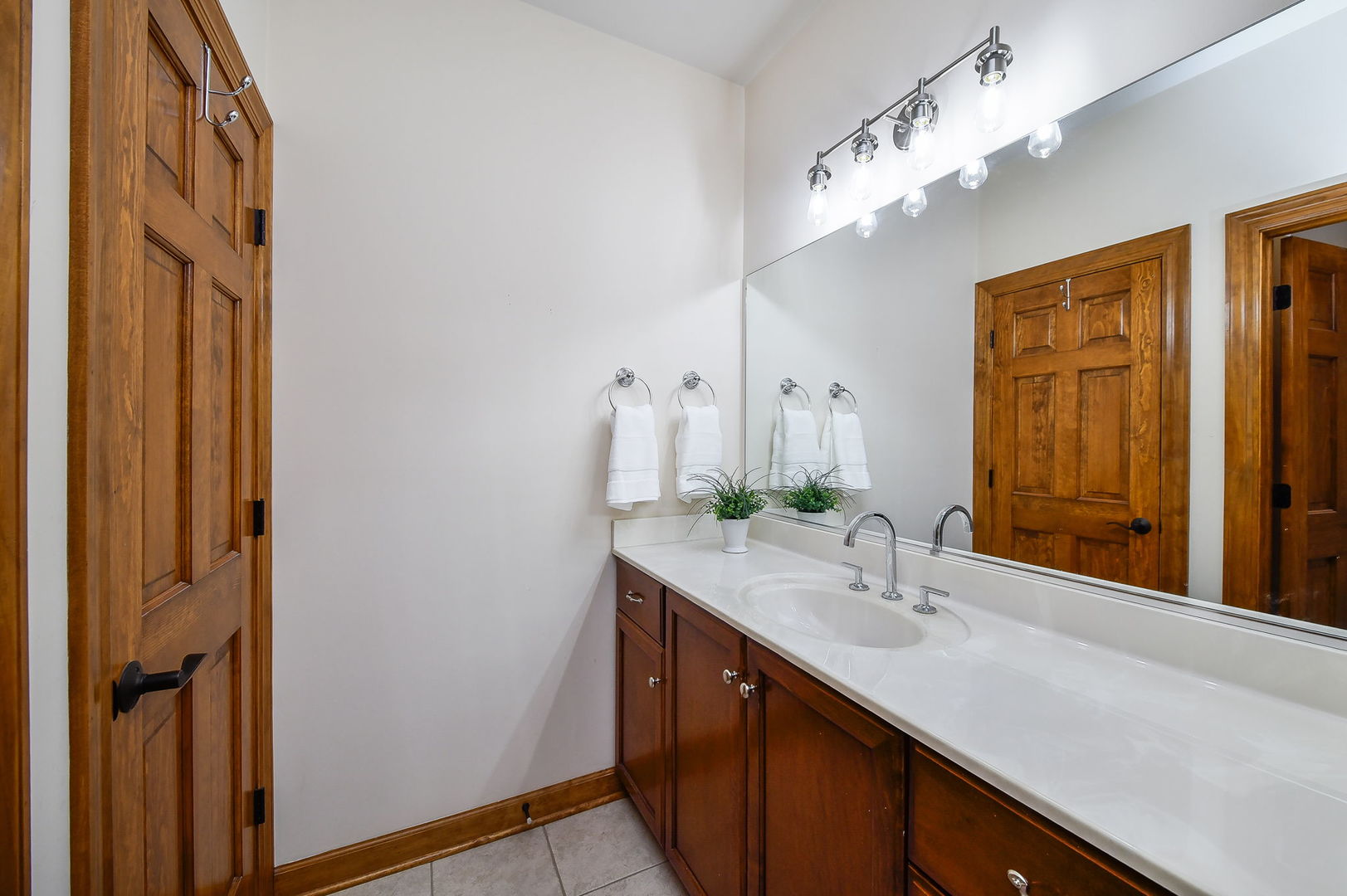 2009 Mackenzie Place, Unit 2009 Wheaton, IL 60187 - Photo 32 of 53 a bathroom with a double vanity sink and a mirror