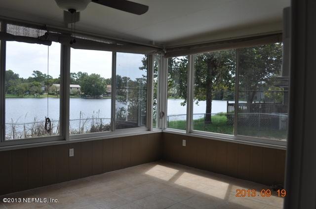 1711 Derringer Road Jacksonville, FL 32225 - Photo 11 of 25 a living room with large windows