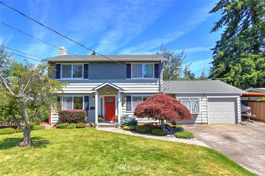 3522 Northeast 10th Place Renton, WA 98056 - Photo 1 of 34 a front view of a house with a garden
