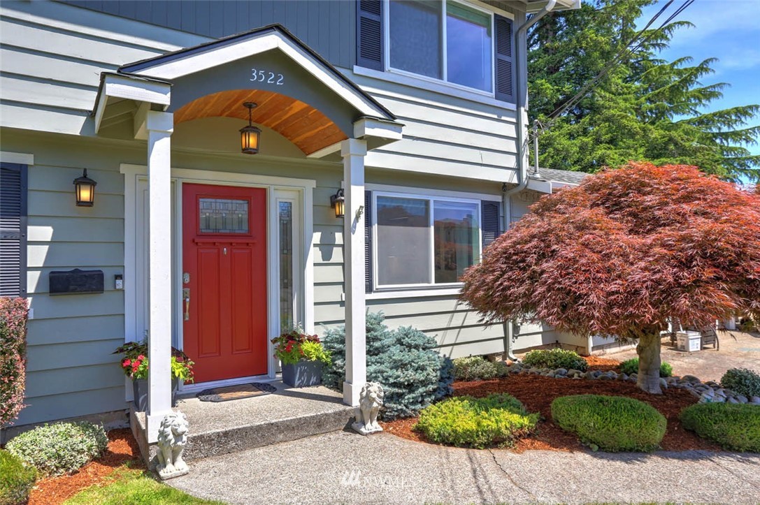 3522 Northeast 10th Place Renton, WA 98056 - Photo 2 of 34 a front view of a house with garden