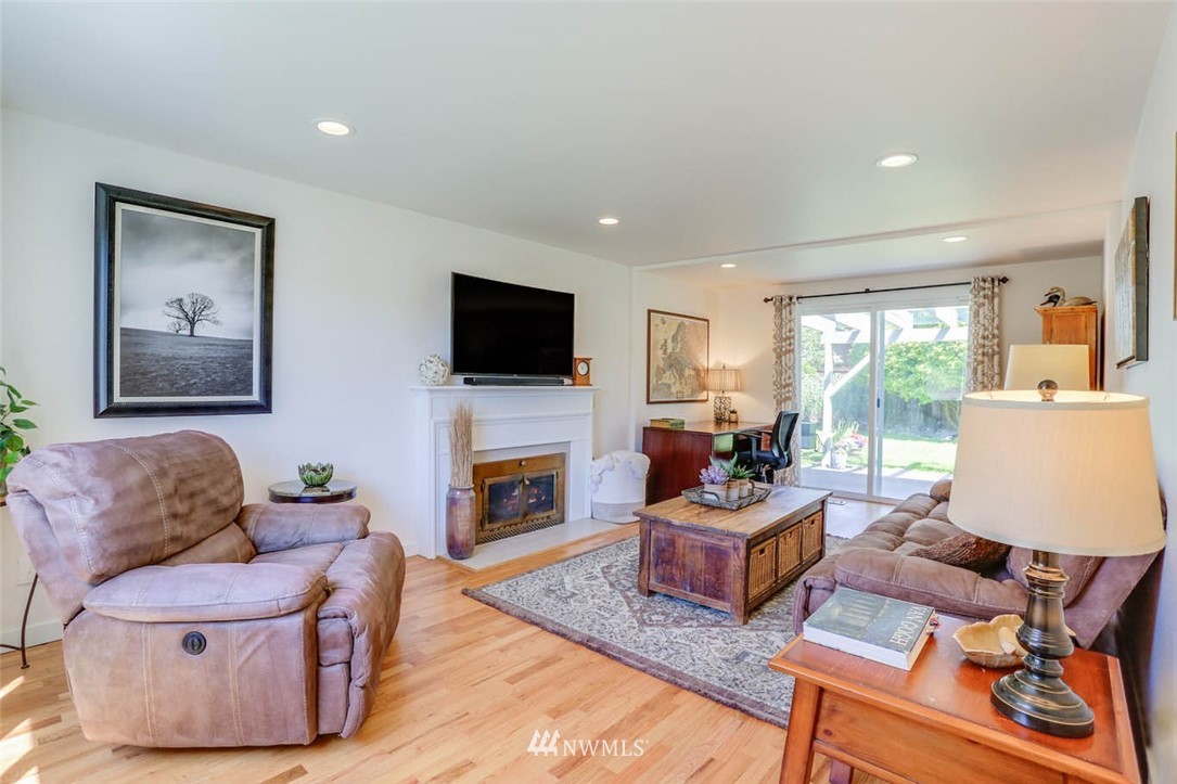 3522 Northeast 10th Place Renton, WA 98056 - Photo 13 of 34 a living room with furniture and a fireplace
